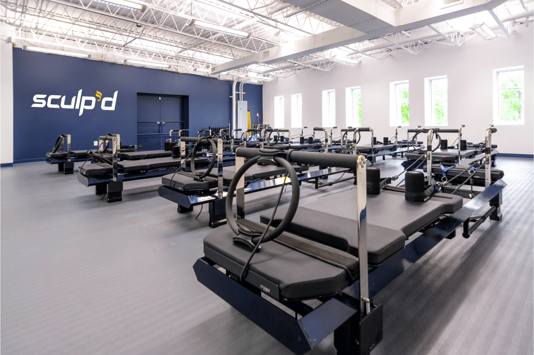 Pilates Reformer Machines Set Up for Class at sculp'd